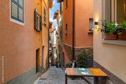 A table for two is set up on a narrow hillside staircase in the historic center of the medieval village of Bellagio  Italy  on the shores of Lake Como.