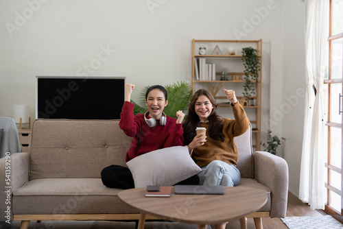 Multiethnic Group Of Young Woman Having Fun, Watching TV