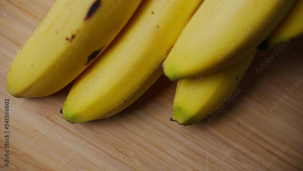 A close up shot of the ends of a bunch of Bananas. A close up shot of the ends of a bunch of Bananas.