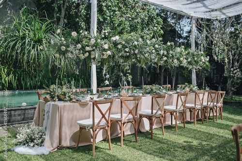 Ornamental decorations with multi flora. Outdoors light. Wedding ceremony or wedding decoration with clear tent in the sunny afternoon natural lights.