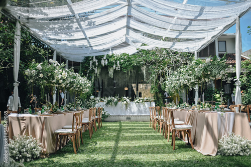 Ornamental decorations with multi flora. Outdoors light. Wedding ceremony or wedding decoration with clear tent in the sunny afternoon natural lights.
