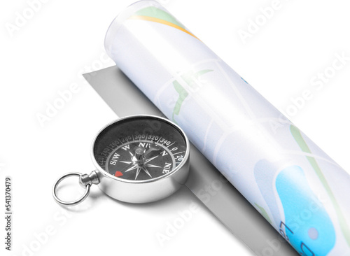 Compass and rolled map on w...