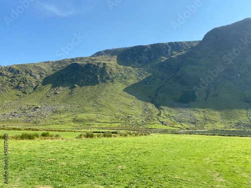 Farmland leading to Glenbeg lake in Ardgroom, Cork, Ireland. photo