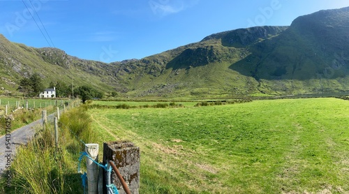 A white farmhouse near Glenbeg lake in Ardgroom, Cork, Ireland. photo