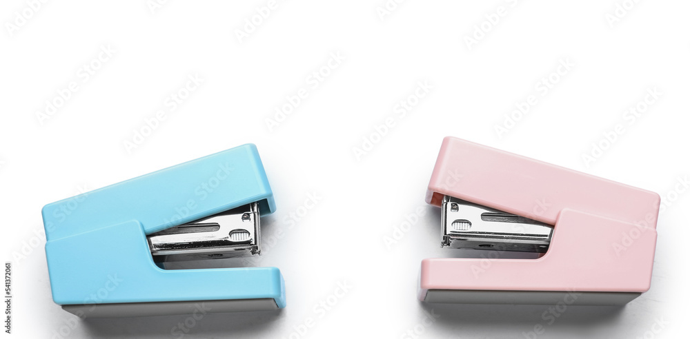 Two colorful staplers isolated on white background Two colorful staplers isolated on white background