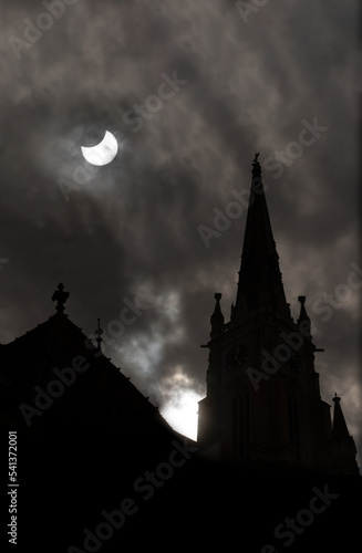 Dark sky over the city,catching Europe lunar Sun eclipse 2022
