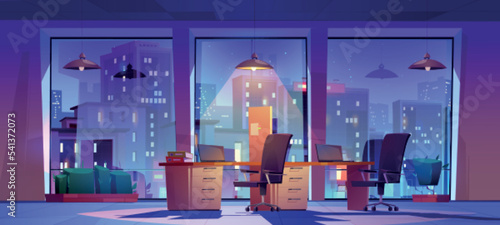 Night office, open space workplace interior with city view in wide floor-to-ceiling windows, glowing lamp over the tables, laptops, chairs and task board. Coworking area Cartoon vector illustration photo