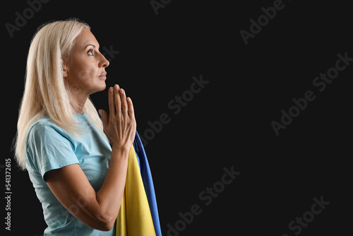Mature woman with flag of U...