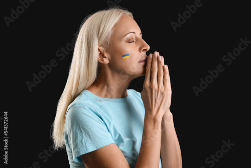 Mature woman with drawn fla...