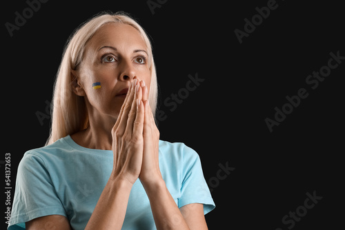 Mature woman with drawn fla...