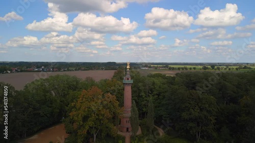 36 meters high monument near Fehrbellin. Battle against the Swedes.
Beautiful aerial view flight point of view POV drone shot
of Victory column Hakenberg at summer 2022. 4k marnitz Cinematic photo