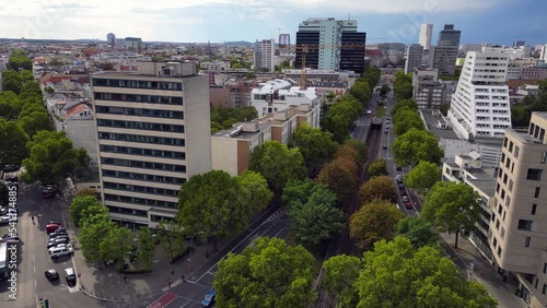 Office building at intersection with railroad.
Breathtaking aerial view flight panorama overview drone
of Nollendorf Place Berlin Germany at summer day 2022. 4k marnitz Cinematic photo