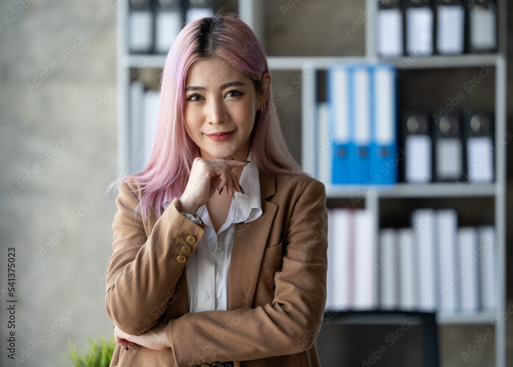 Young beautiful woman working in the office. Relaxing in office