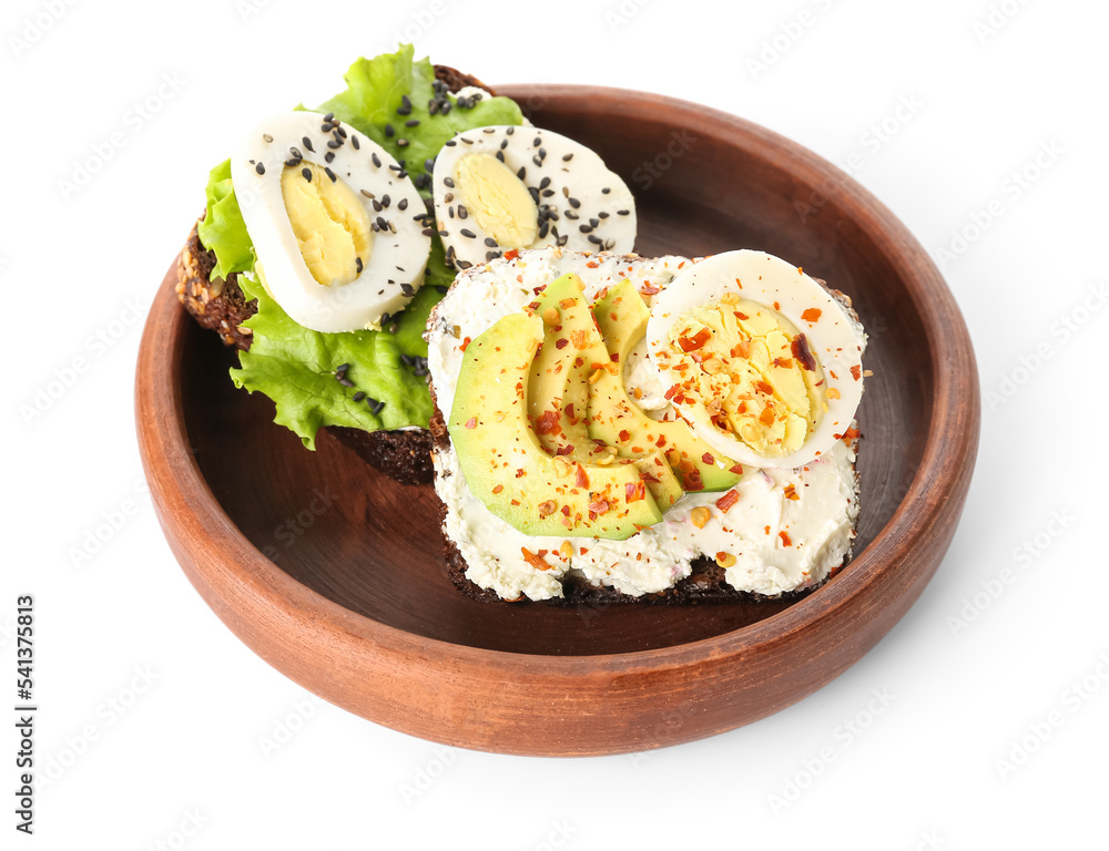 Bowl and toasts with boiled egg on white background