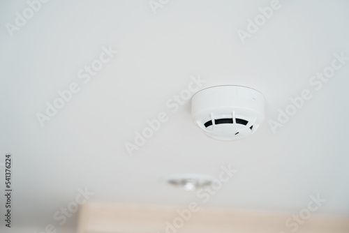 Принти на полотні Smoke sensor detector mounted on roof in home or apartment