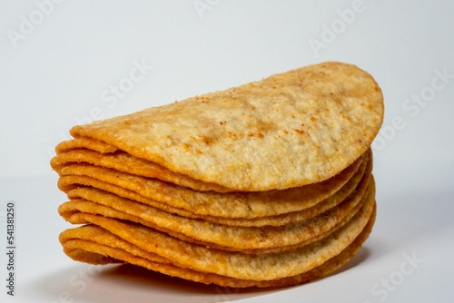 Closeup shot of the stack potatoes chips isolated on gray background