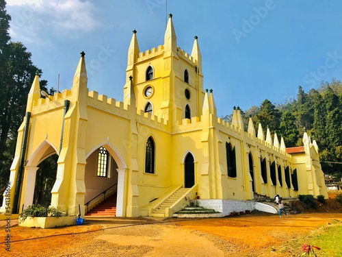 St. Stephen's Church in Ooty India surrounded by vegetation photo