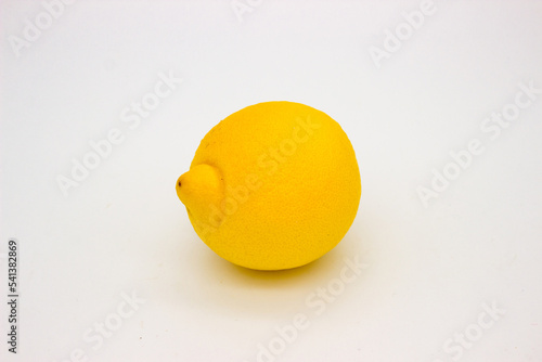 Ripe lemon on light background. Isolated image