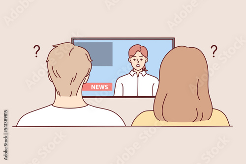 Confused couple sit on sofa frustrated with news on TV. Distressed man and woman shocked with reportage on television. Media propaganda. Vector illustration. 