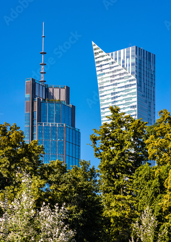 Panoramic view of modern architecture and skyscrapers of Srodmiescie downtown business district of Warsaw city center in Poland photo