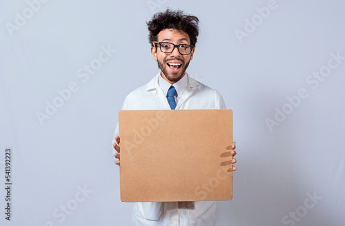 A scientist in a white coat is holding and showing a blank clipboard. Scientist showing and pointing at a blank clipboard, Professor in white coat holding and showing a blank clipboard isolated