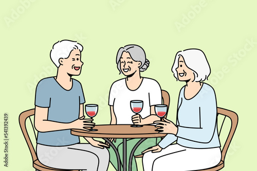 Smiling elderly people sit at table in restaurant drink wine laughing relaxing together. Joyful mature friends enjoy time in cafe. Happy maturity. Vector illustration. 