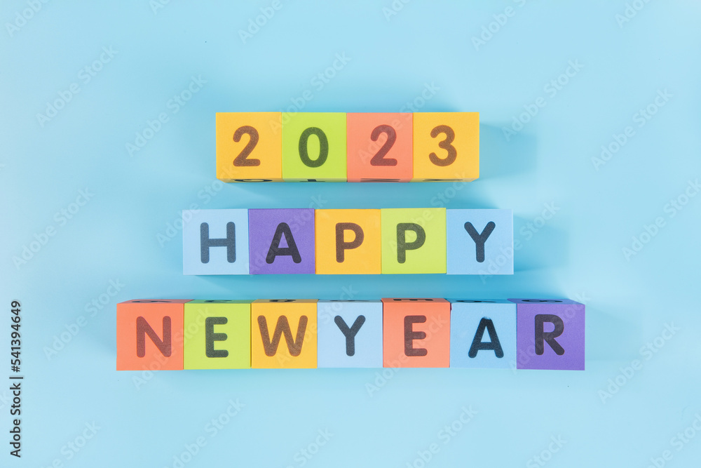 2023 happy new.cloorful cube on blue background. New year change and starting concept. 2023 happy new.cloorful cube on blue background. New year change and starting concept.