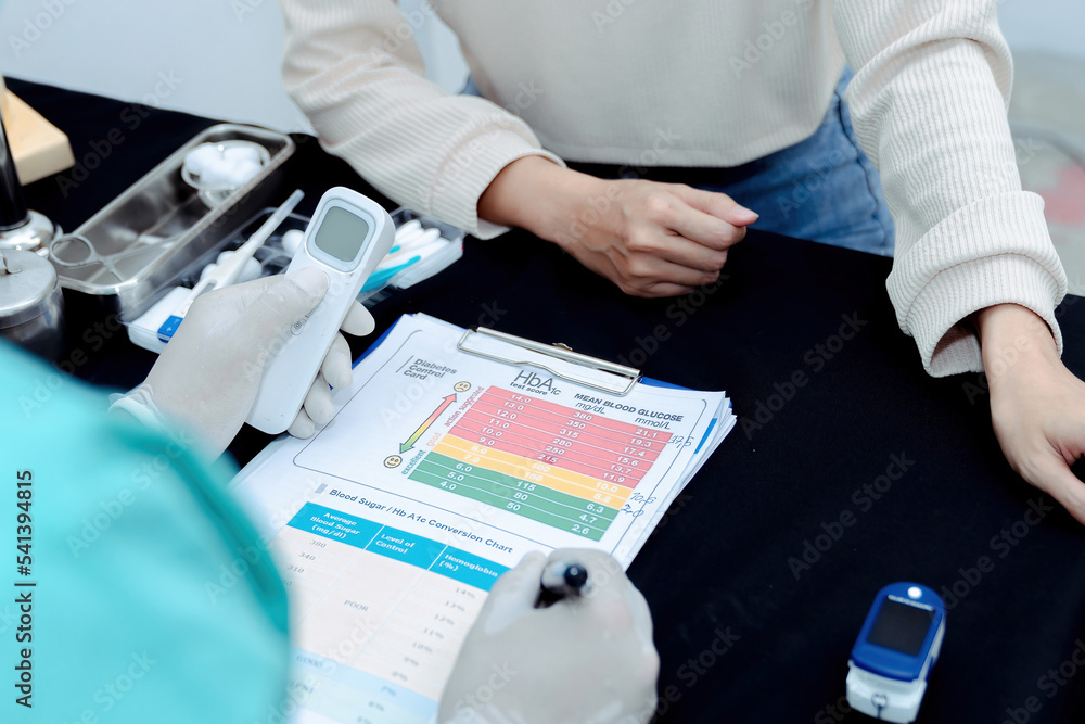 Medicine and health concept. Young woman doctor, records the readings of the thermometer. Medicine and health concept. Young woman doctor, records the readings of the thermometer.