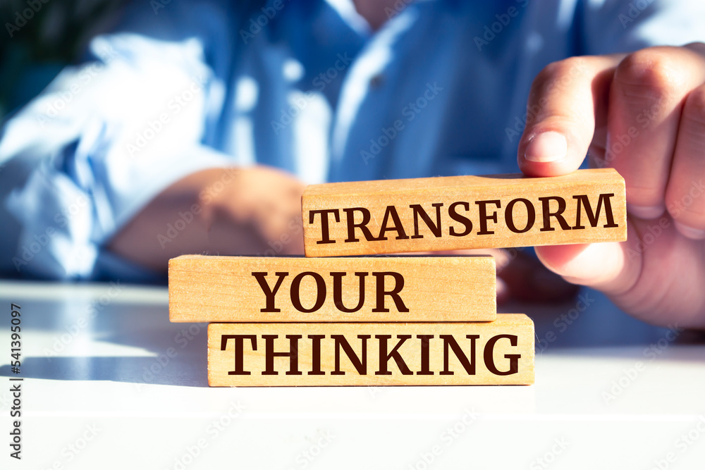 Wooden blocks with words 'Transform your thinking'. Wooden blocks with words 'Transform your thinking'.