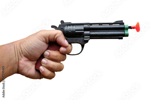 Hand holding toy gun on white background