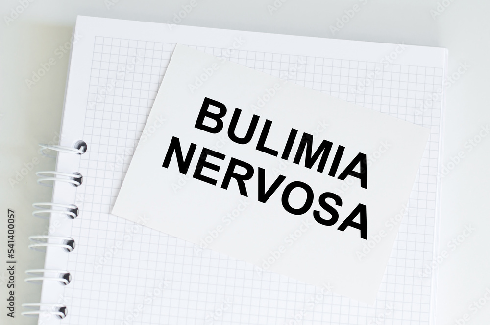 a white card with the text BULIMIA NERVOSA. Medical concept a white card with the text BULIMIA NERVOSA. Medical concept