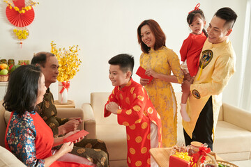 Boy Greeting Grandparents