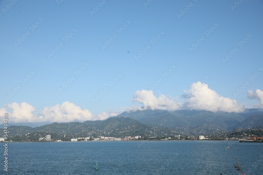 Picturesque view of city near sea and mountains Picturesque view of city near sea and mountains
