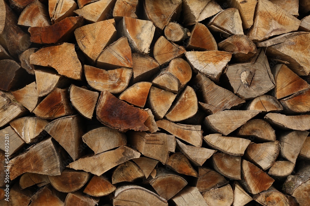 Stack of chopped firewood as background, closeup Stack of chopped firewood as background, closeup