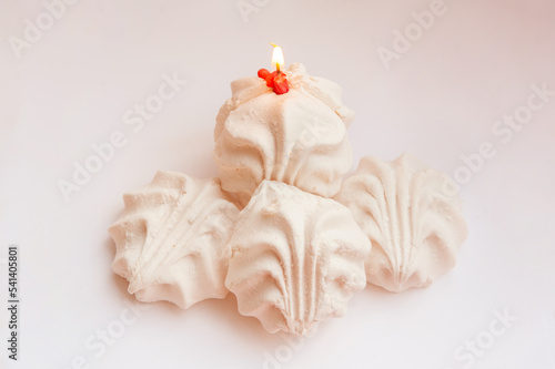 slide of marshmallows with a burnt out candle on top. copy space