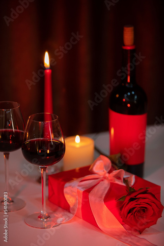 romantic date concept red wine with glasses and candles