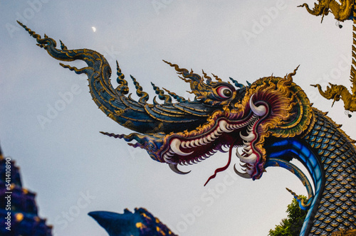 September 3,2022 A head of blue naga statue at Wat Rong Suer Ten temple (Blue Temple ) in Chiangrai City , Thailand