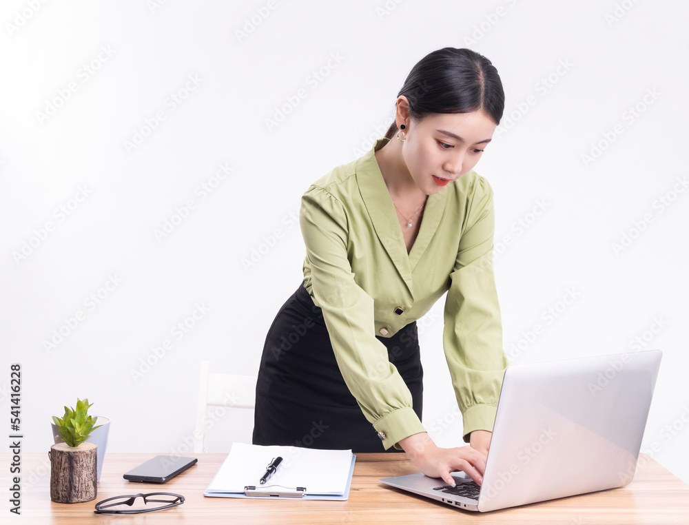 Business women standing at their desks Business women standing at their desks