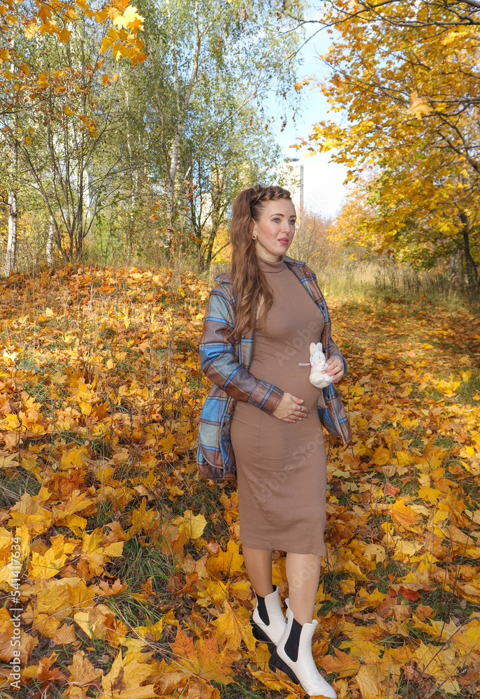 A happy young woman is waiting for her baby A happy young woman is waiting for her baby