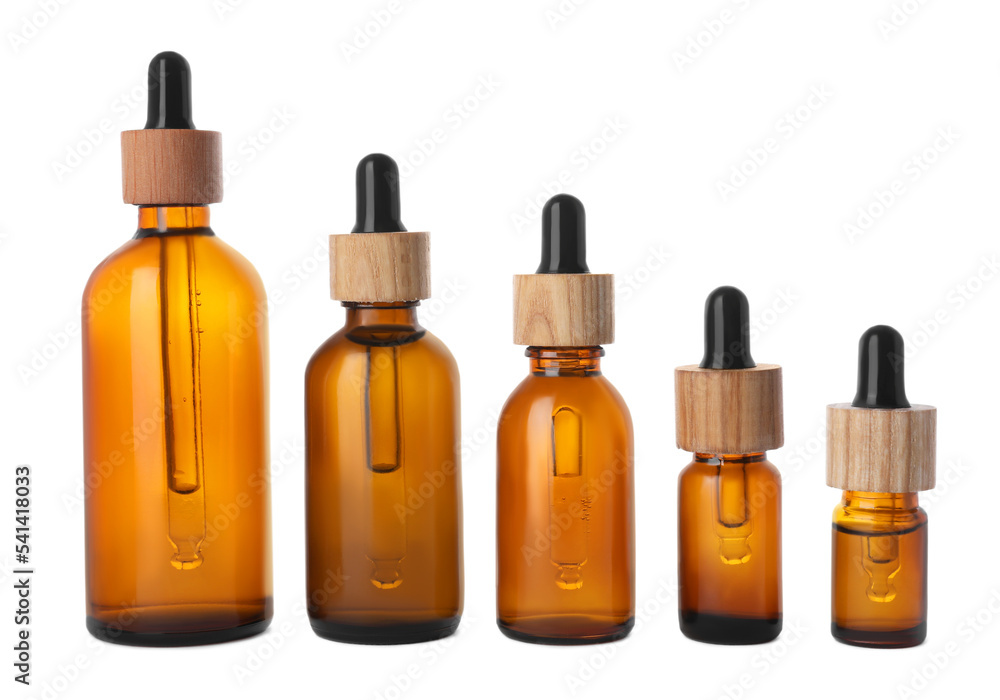 Row with different bottles of essential oil on white background Row with different bottles of essential oil on white background
