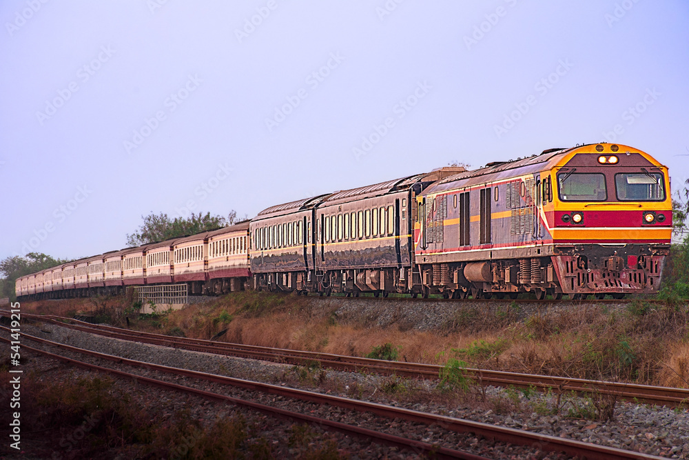 Passenger train by diesel locomotive on the railway. Passenger train by diesel locomotive on the railway.