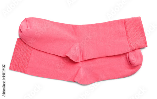 Pair of pink socks on white background, top view