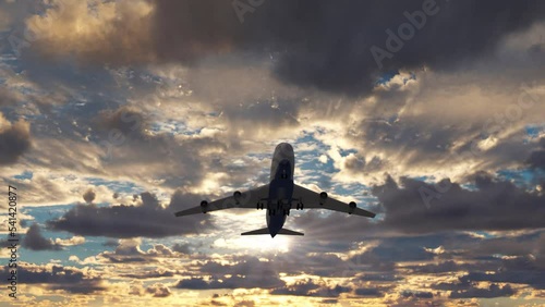 Scene with a big passenger airplane taking off from airport runway against evening sky. Departure of the tourists to the travel vacations on the commercial airliner jet on a background of sunset sky. photo