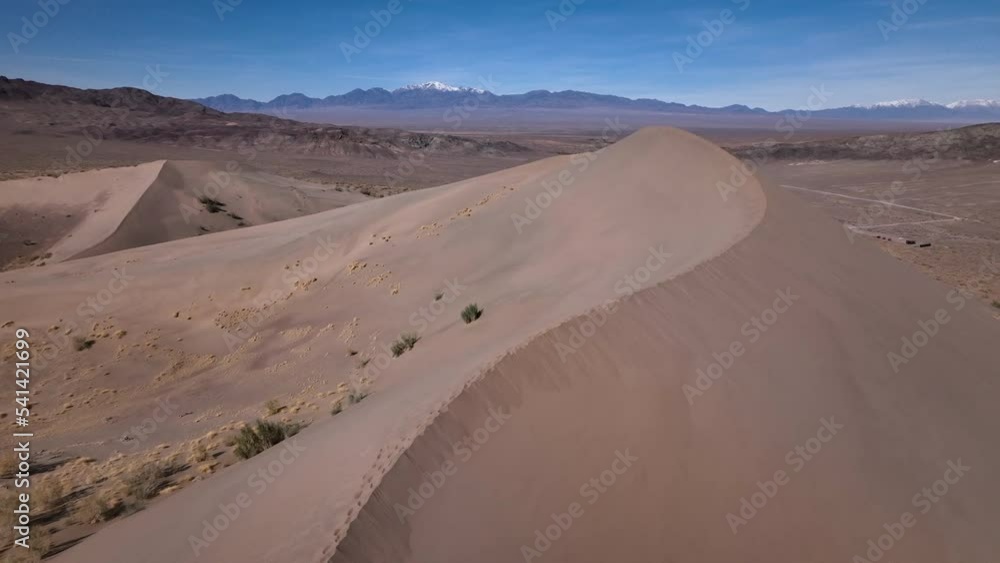 The winding ridge of the dune crest. Altyn-Emel National Park, Kazakhstan. The winding ridge of the dune crest. Altyn-Emel National Park, Kazakhstan.