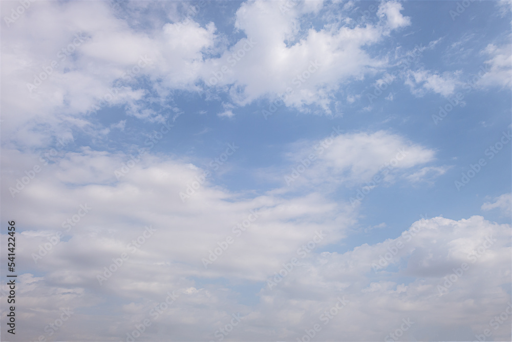 abstract background of white fluffy clouds on a bright blue sky abstract background of white fluffy clouds on a bright blue sky