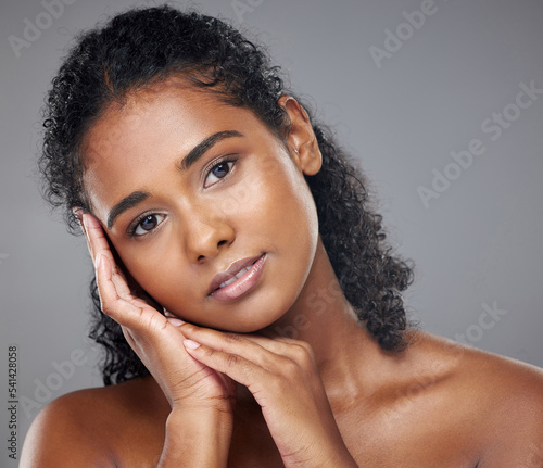 Face makeup, portrait and indian woman skincare with glow from cosmetics against a mockup studio background. Girl model with skin beauty from cosmetic smooth and clean body care with mockup space