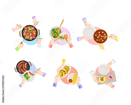 Top view of served dinner dishes and people hands holding cutleries set cartoon vector illustration
