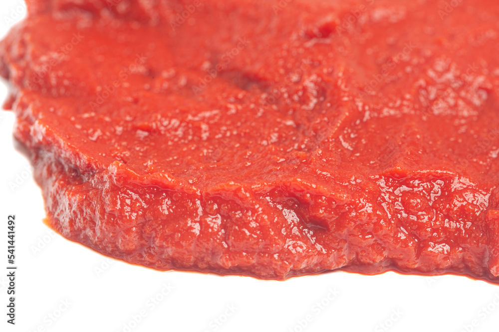 Tomato paste texture isolated on white