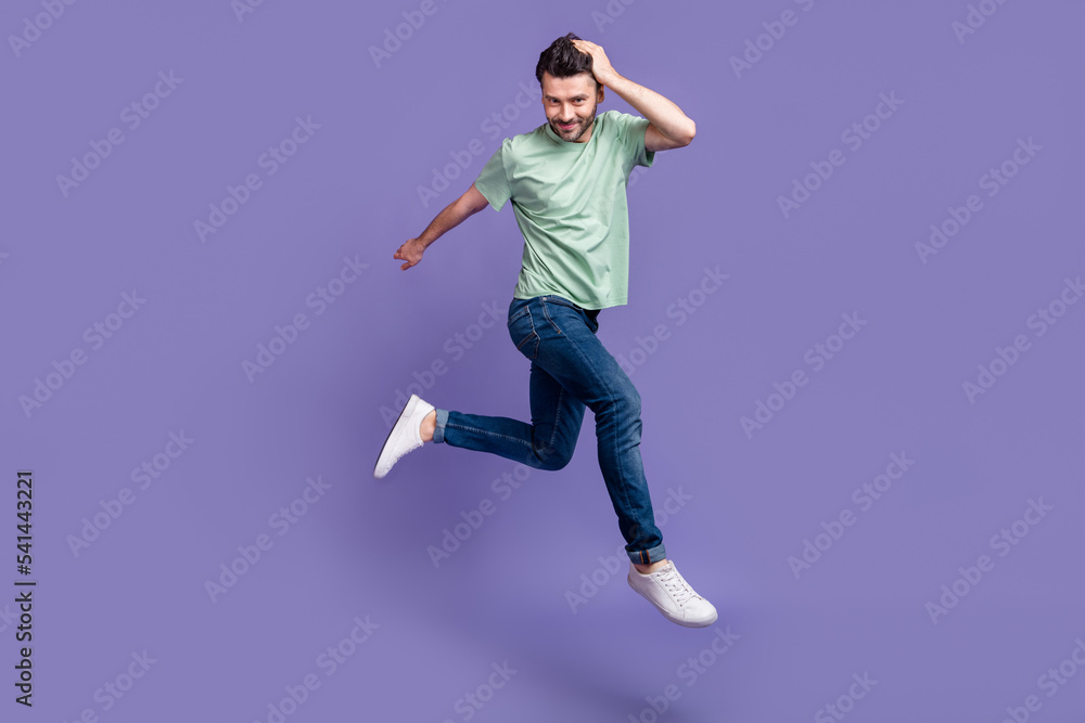 Full length photo of cheerful attractive virile man enjoy new hairdo dressed trendy clothes isolated on purple color background