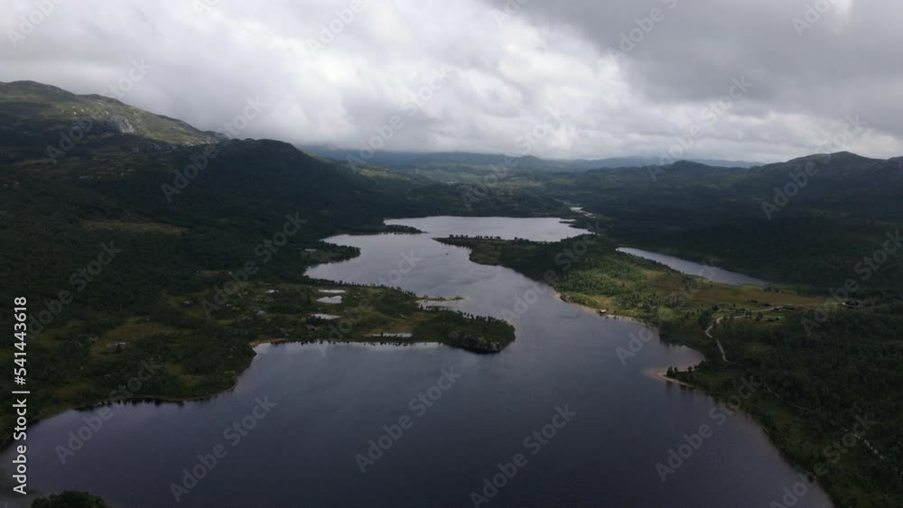 A drone shot of a farm with beautiful nature and the Telemark canal in Norway A drone shot of a farm with beautiful nature and the Telemark canal in Norway